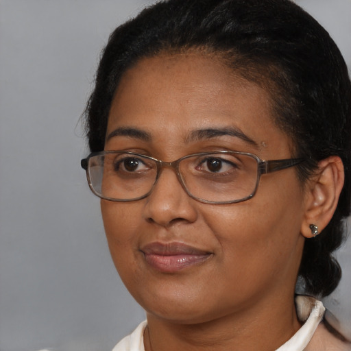 Joyful asian adult female with short  brown hair and brown eyes