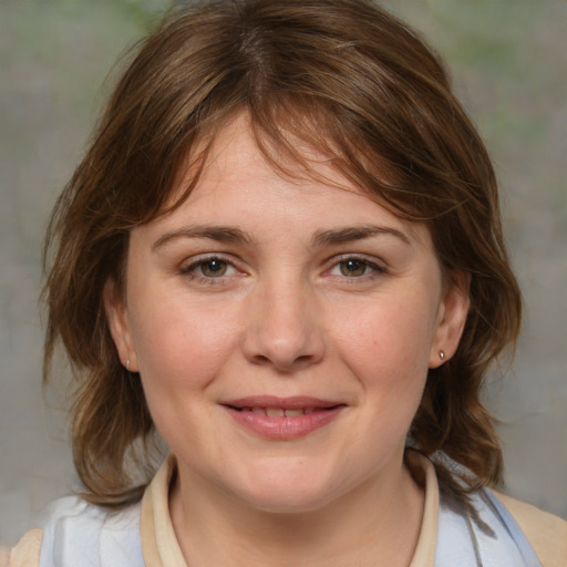 Joyful white young-adult female with medium  brown hair and blue eyes