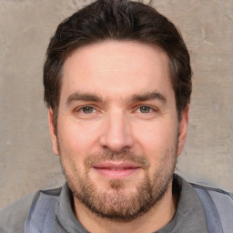 Joyful white adult male with short  brown hair and grey eyes