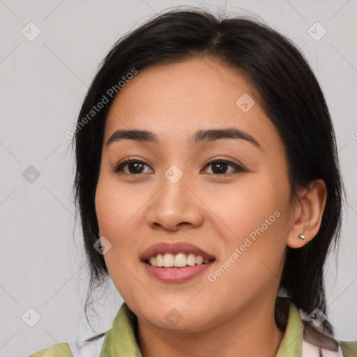 Joyful asian young-adult female with medium  brown hair and brown eyes