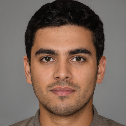 Neutral latino young-adult male with short  brown hair and brown eyes