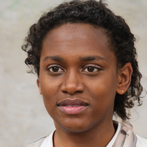 Neutral black young-adult female with short  brown hair and brown eyes