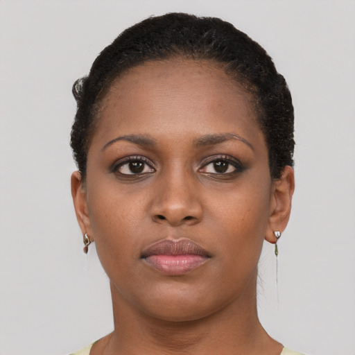 Neutral black young-adult female with short  brown hair and brown eyes