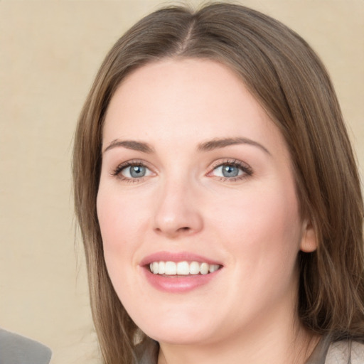 Joyful white young-adult female with medium  brown hair and green eyes