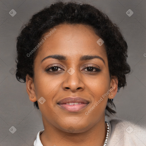 Joyful black young-adult female with short  brown hair and brown eyes