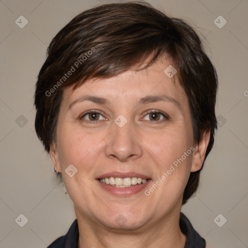 Joyful white adult female with medium  brown hair and brown eyes