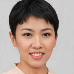 Joyful asian young-adult female with short  brown hair and brown eyes