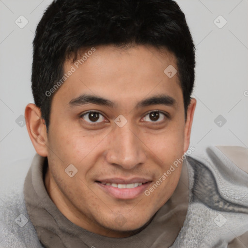 Joyful latino young-adult male with short  brown hair and brown eyes