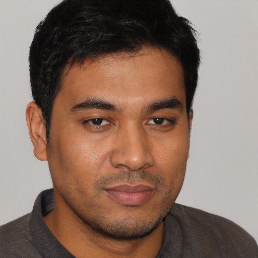 Neutral latino young-adult male with short  brown hair and brown eyes