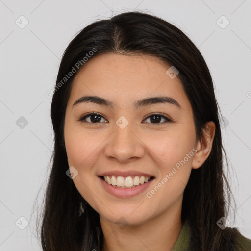 Joyful asian young-adult female with long  brown hair and brown eyes