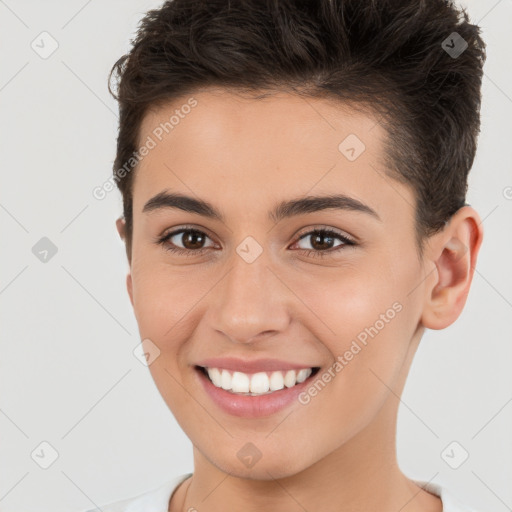 Joyful white young-adult female with short  brown hair and brown eyes