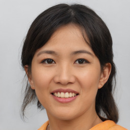 Joyful asian young-adult female with medium  brown hair and brown eyes