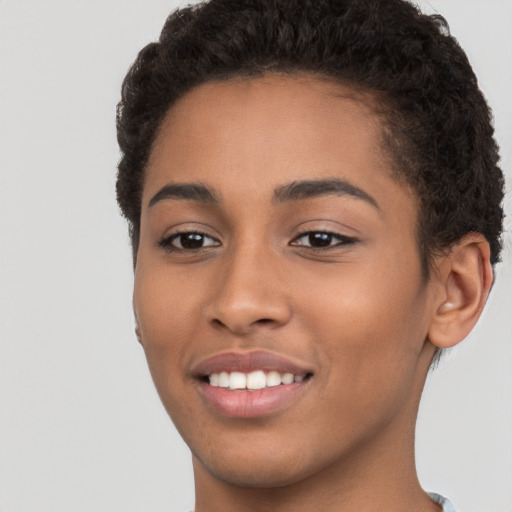 Joyful latino young-adult female with short  brown hair and brown eyes