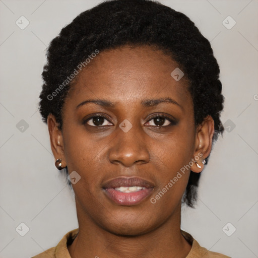 Joyful black young-adult female with short  black hair and brown eyes