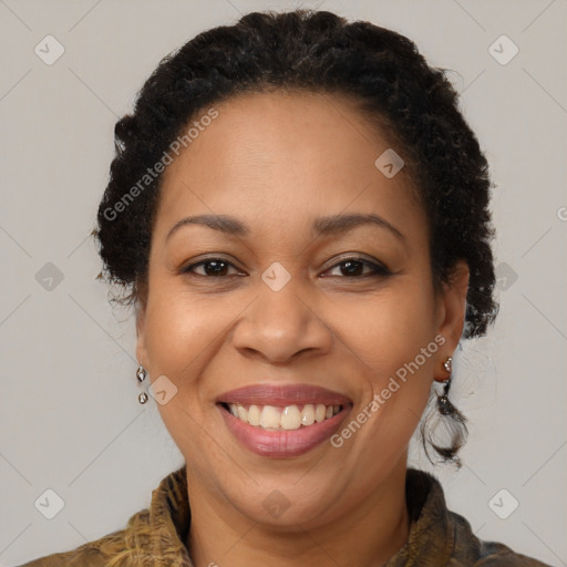 Joyful black adult female with short  brown hair and brown eyes