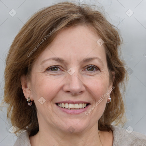 Joyful white adult female with medium  brown hair and blue eyes