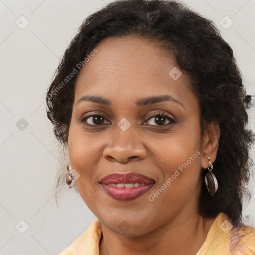 Joyful black young-adult female with medium  brown hair and brown eyes