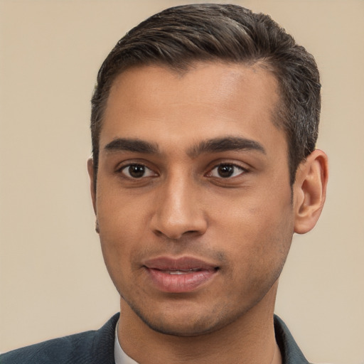 Joyful white young-adult male with short  black hair and brown eyes