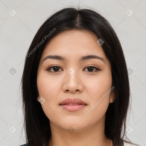 Joyful latino young-adult female with long  brown hair and brown eyes