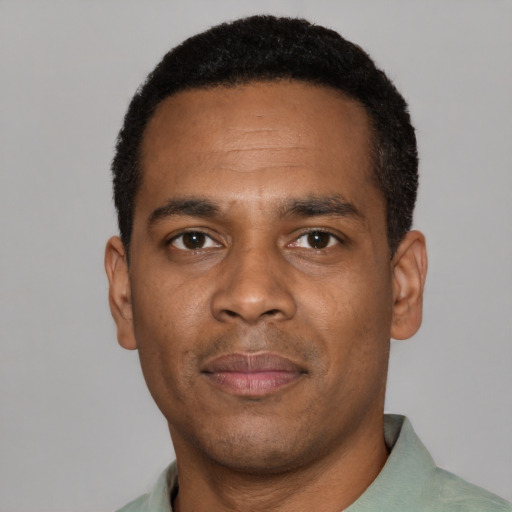 Neutral black young-adult male with short  black hair and brown eyes