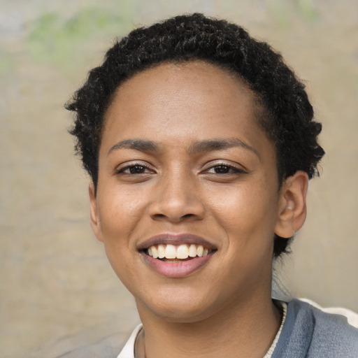 Joyful latino young-adult female with short  black hair and brown eyes