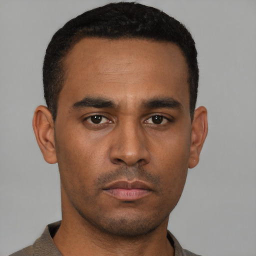 Neutral latino young-adult male with short  brown hair and brown eyes