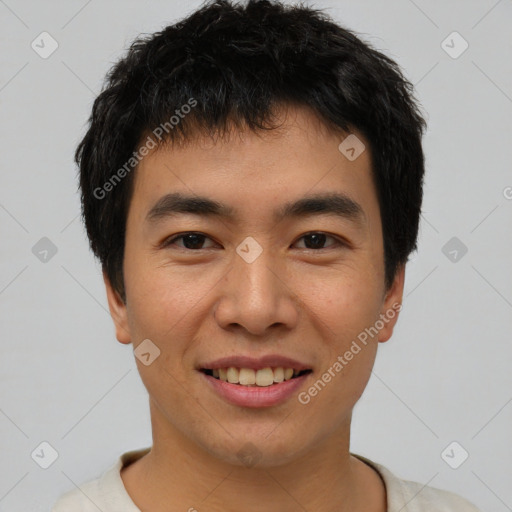 Joyful asian young-adult male with short  black hair and brown eyes