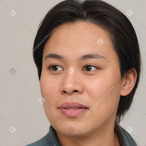 Joyful asian young-adult female with medium  brown hair and brown eyes