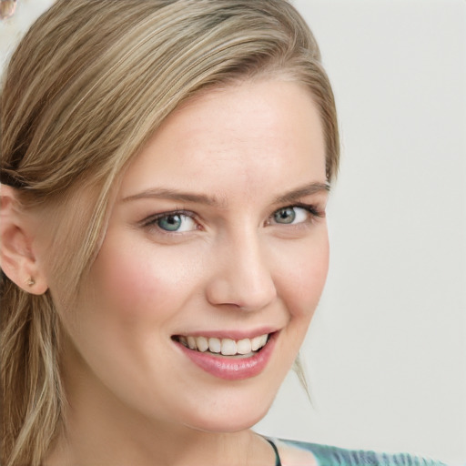 Joyful white young-adult female with long  brown hair and blue eyes