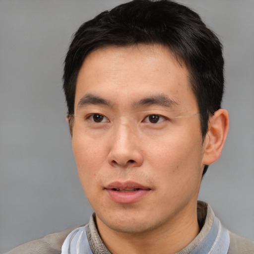 Neutral asian young-adult male with short  black hair and brown eyes