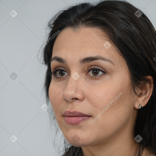 Joyful white adult female with medium  brown hair and brown eyes