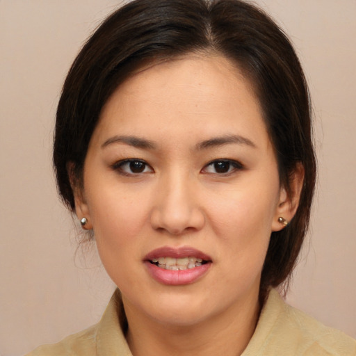 Joyful white young-adult female with medium  brown hair and brown eyes