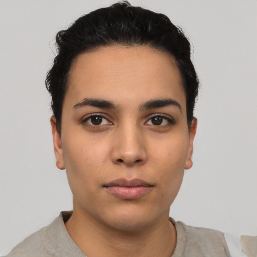 Neutral latino young-adult female with short  black hair and brown eyes