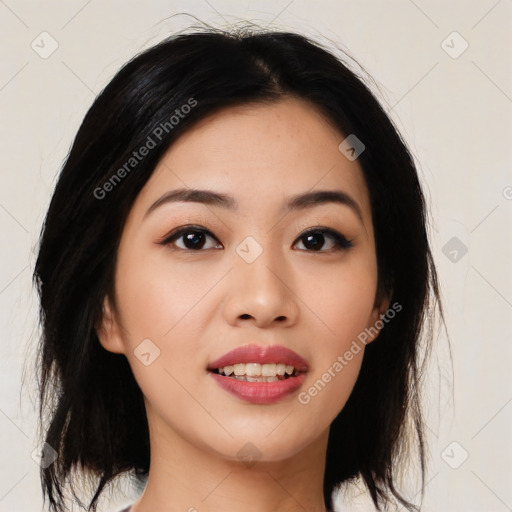 Joyful asian young-adult female with medium  black hair and brown eyes