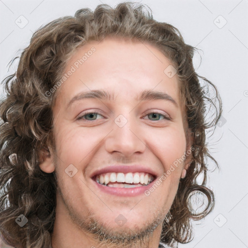 Joyful white young-adult female with long  brown hair and green eyes