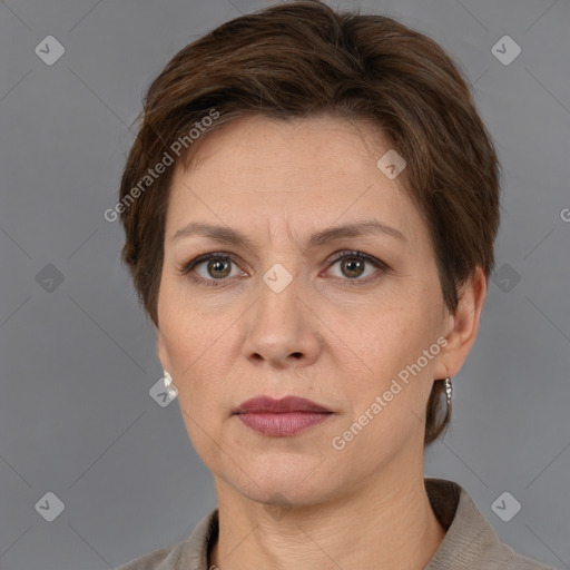 Joyful white adult female with short  brown hair and grey eyes