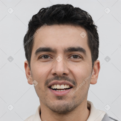 Joyful white young-adult male with short  black hair and brown eyes