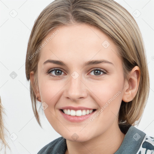 Joyful white young-adult female with medium  brown hair and grey eyes