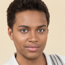 Joyful black young-adult male with short  brown hair and brown eyes