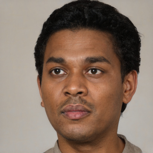 Neutral black young-adult male with short  black hair and brown eyes