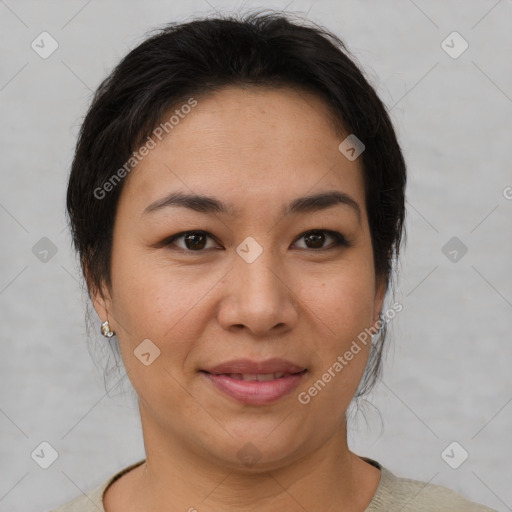 Joyful asian young-adult female with short  brown hair and brown eyes