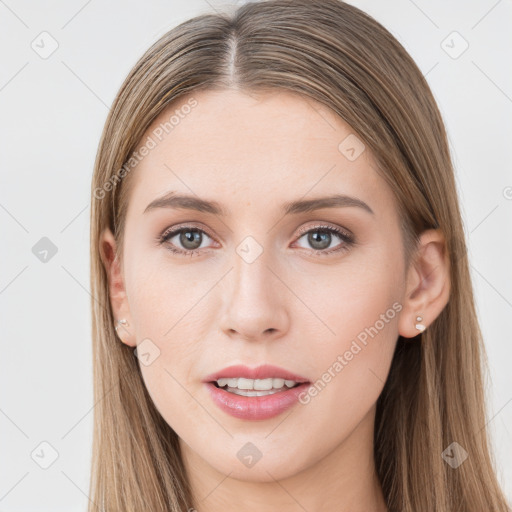 Joyful white young-adult female with long  brown hair and grey eyes