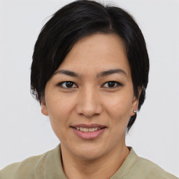 Joyful asian young-adult female with short  brown hair and brown eyes