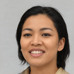 Joyful asian young-adult female with medium  black hair and brown eyes