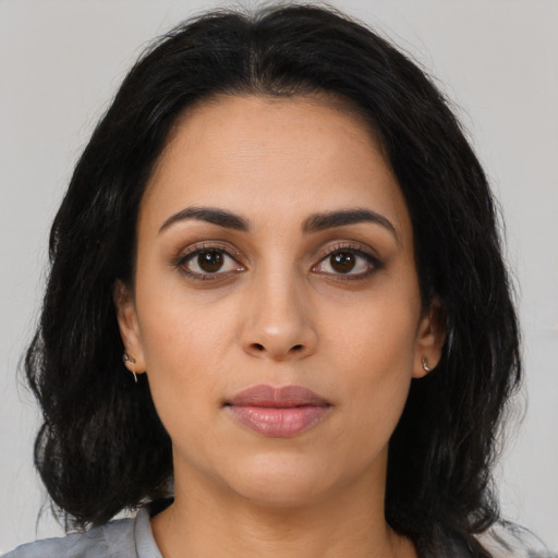 Neutral latino young-adult female with medium  black hair and brown eyes