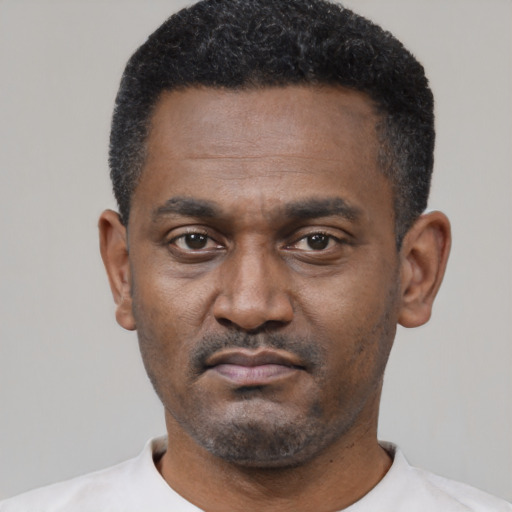 Neutral black young-adult male with short  black hair and brown eyes