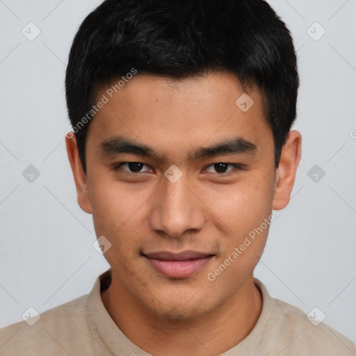 Joyful asian young-adult male with short  black hair and brown eyes