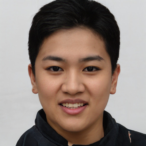 Joyful asian young-adult female with short  black hair and brown eyes
