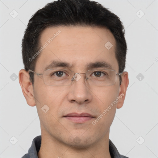 Joyful white adult male with short  brown hair and brown eyes