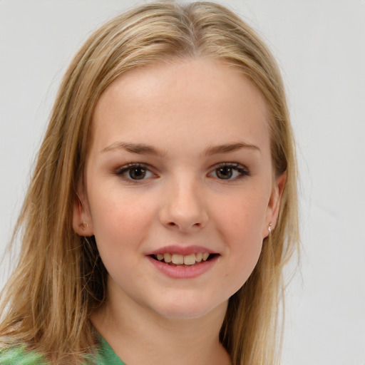 Joyful white child female with long  brown hair and brown eyes